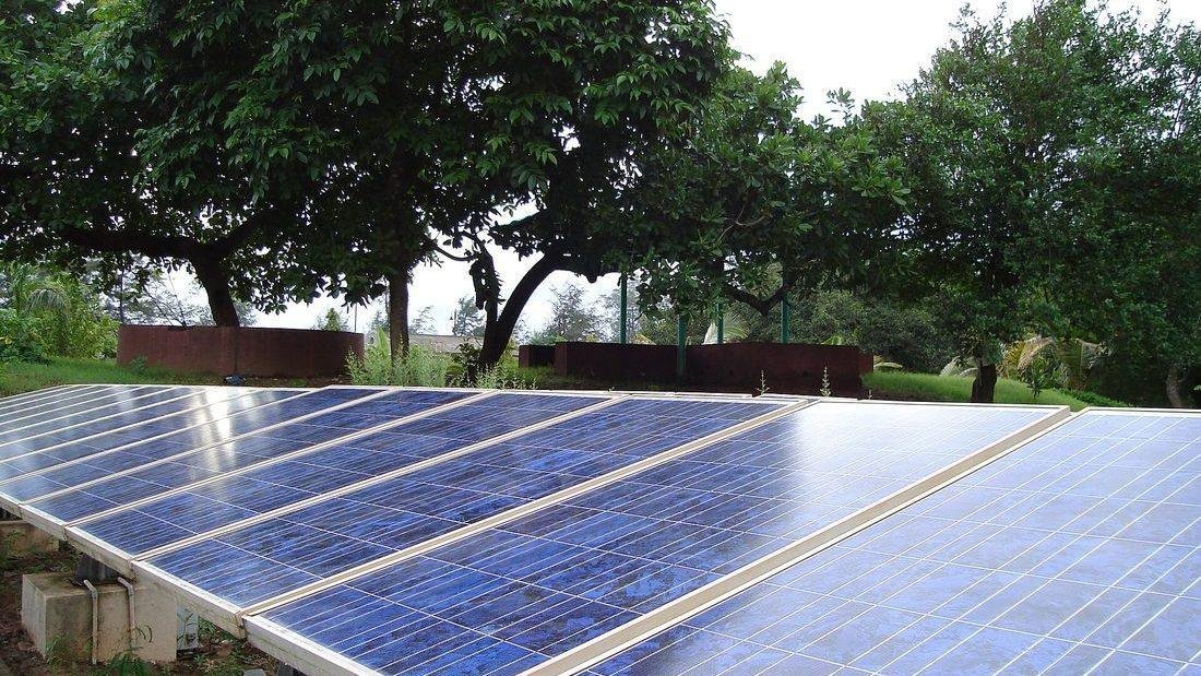 Solar panel installation at an Indian institutional building showing a grid-connected array