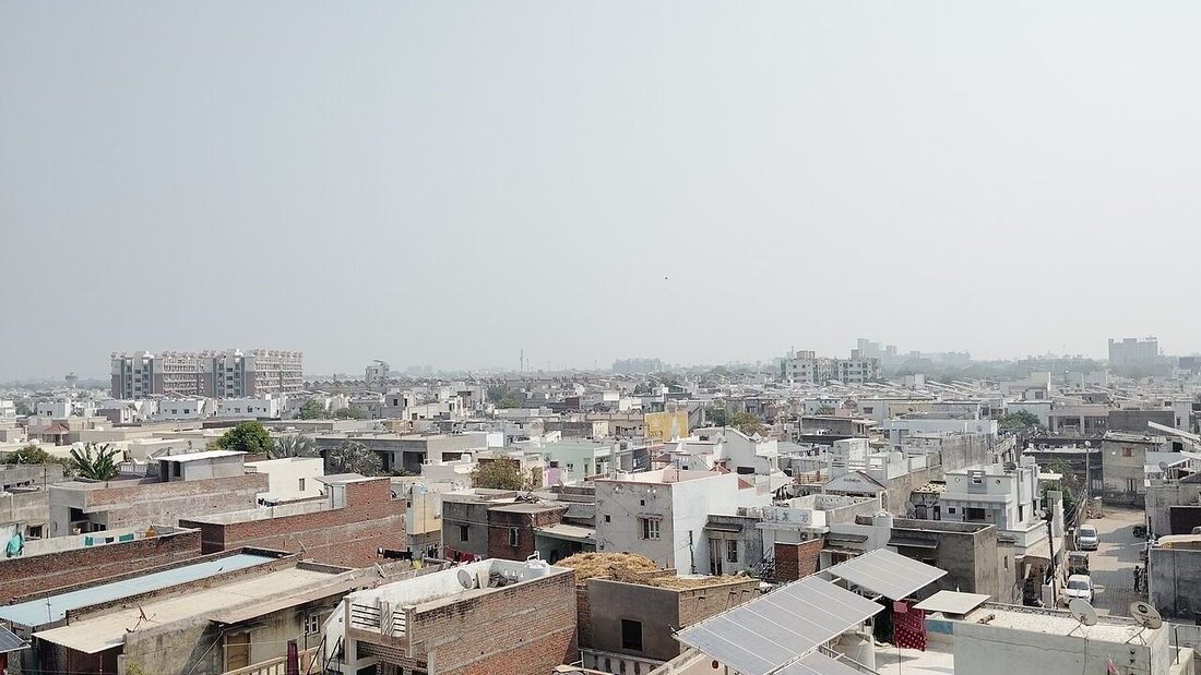 Rows of rooftop solar panels installed on Indian homes, showing completed residential solar installation work