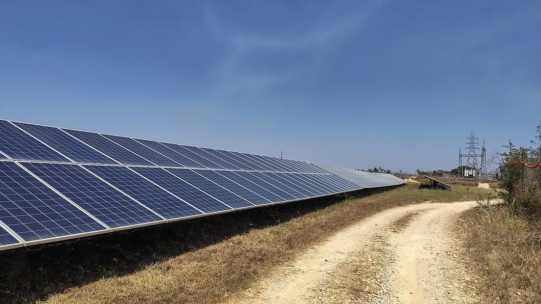 Clean solar panel array in India under maintenance, showing long-term solar system care
